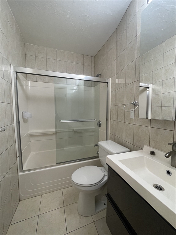 1616 Beacon Street, Unit 3 Brookline, MA 02446 - Photo 12 of 17 a bathroom with a sink a toilet and shower