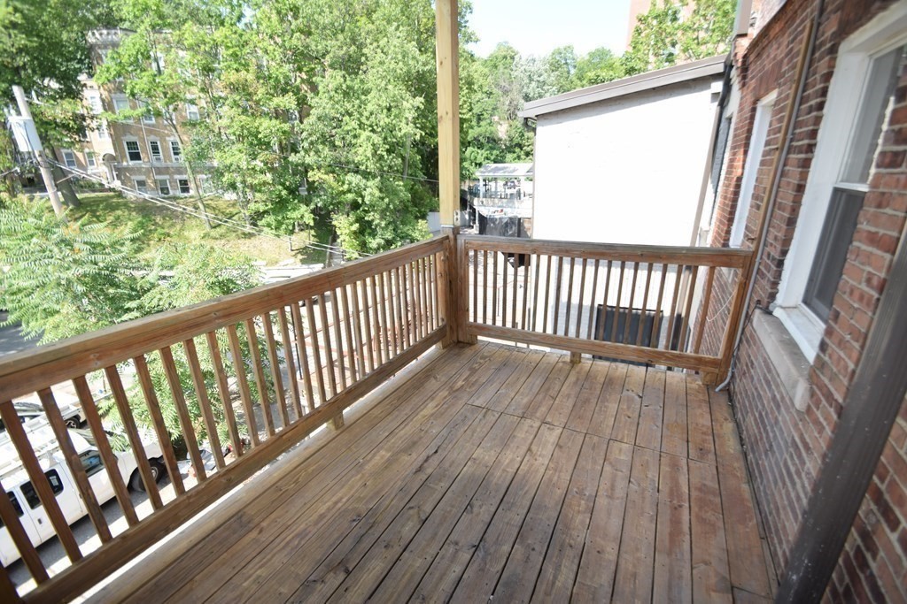 1616 Beacon Street, Unit 3 Brookline, MA 02446 - Photo 17 of 17 a view of balcony with wooden floor