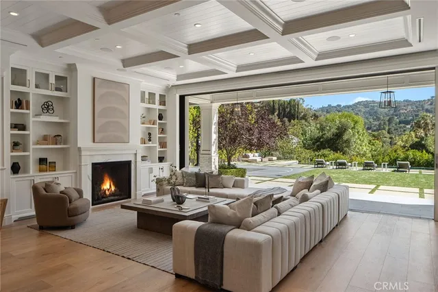 a kitchen with a sink a window and chairs