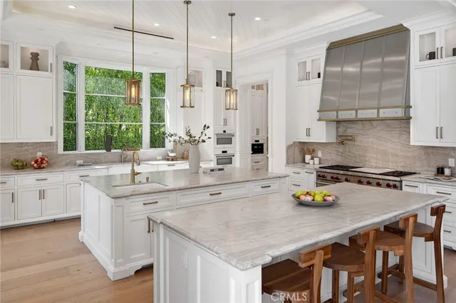 a spacious bedroom with a bed and a fireplace
