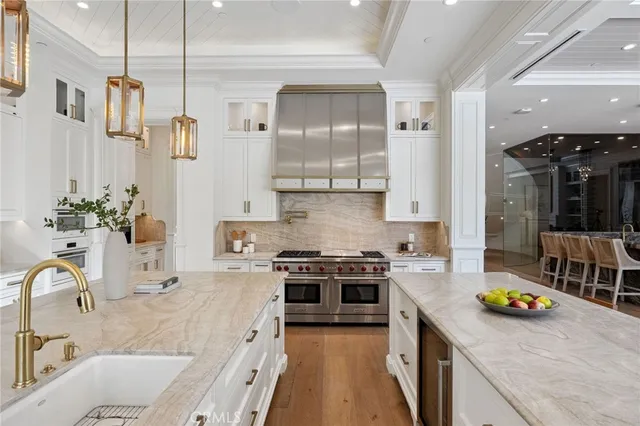 a bathroom with a double vanity sink mirror and bathtub