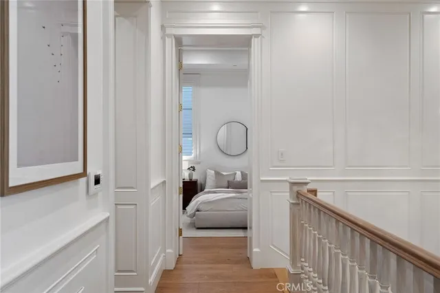 a bedroom with bed and a night stand