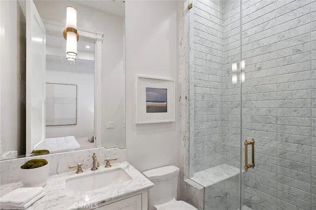 a terrace of a house with couches and a table and chairs