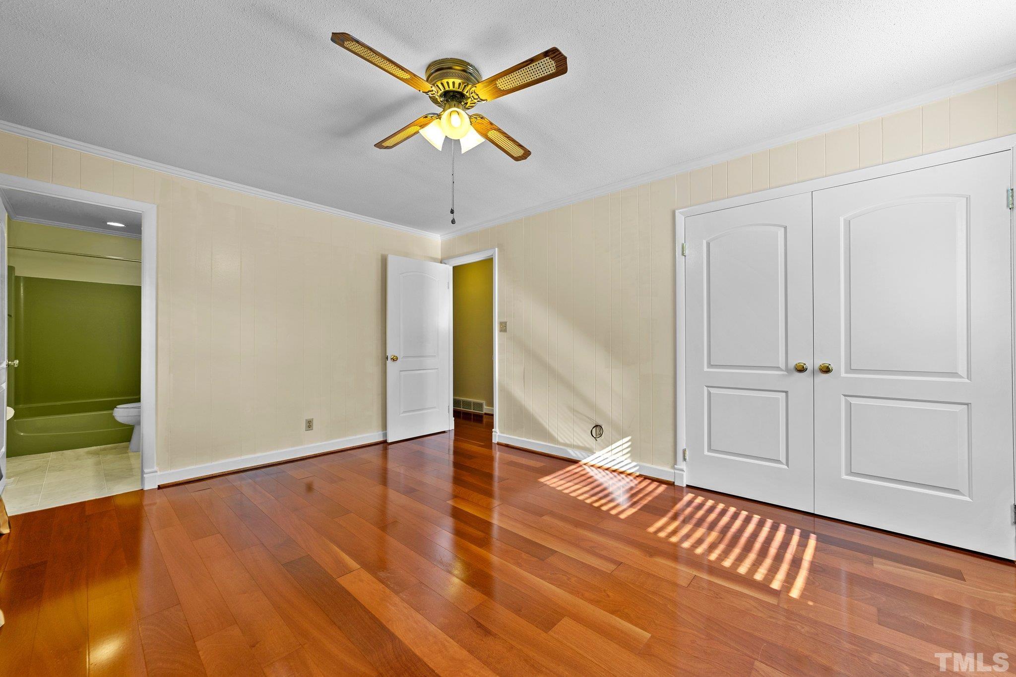 1275 Spring Valley Lake Road Henderson, NC 27537 - Photo 12 of 30 a view of an empty room with wooden floor