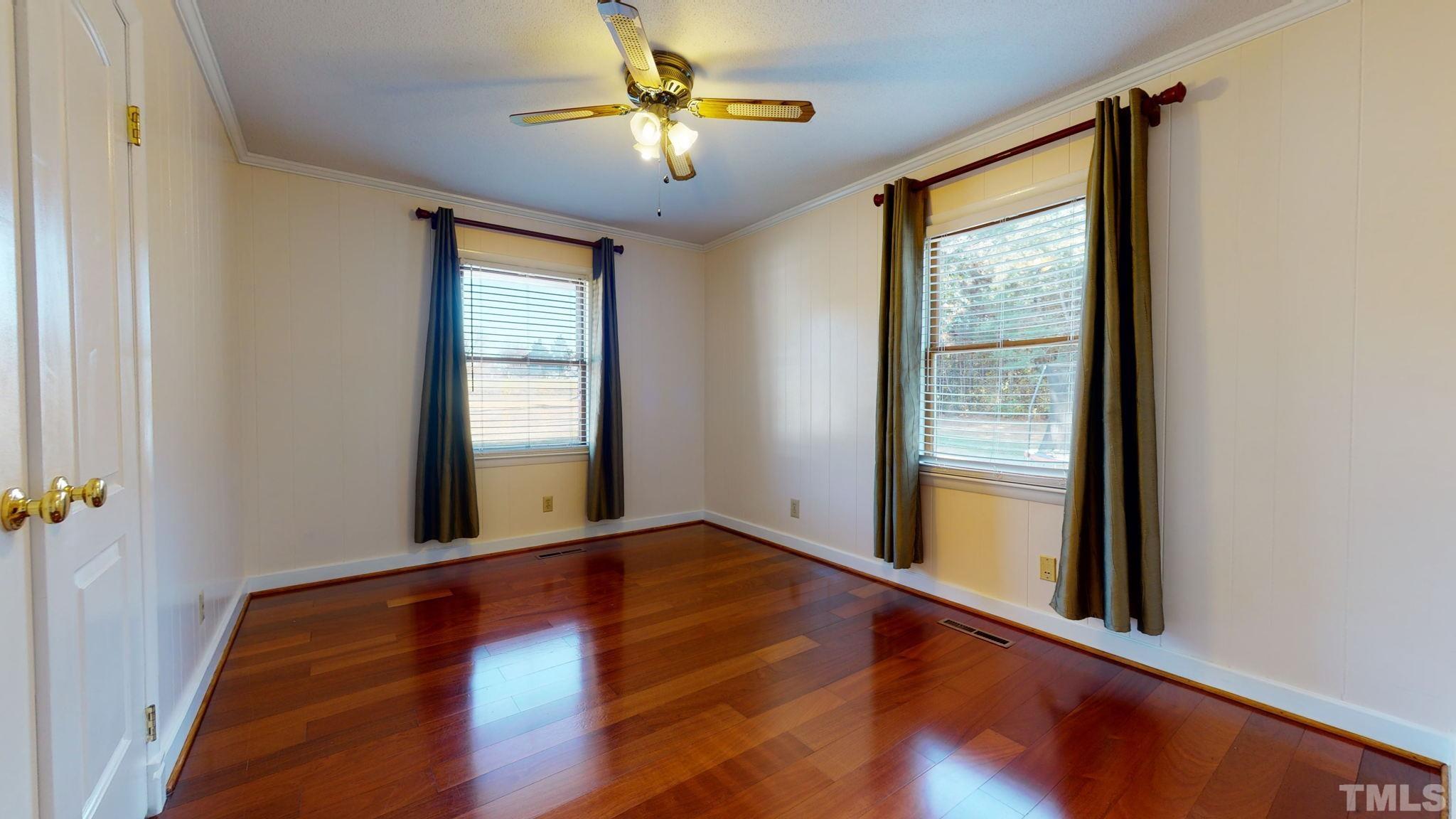 1275 Spring Valley Lake Road Henderson, NC 27537 - Photo 14 of 30 an empty room with windows and closet