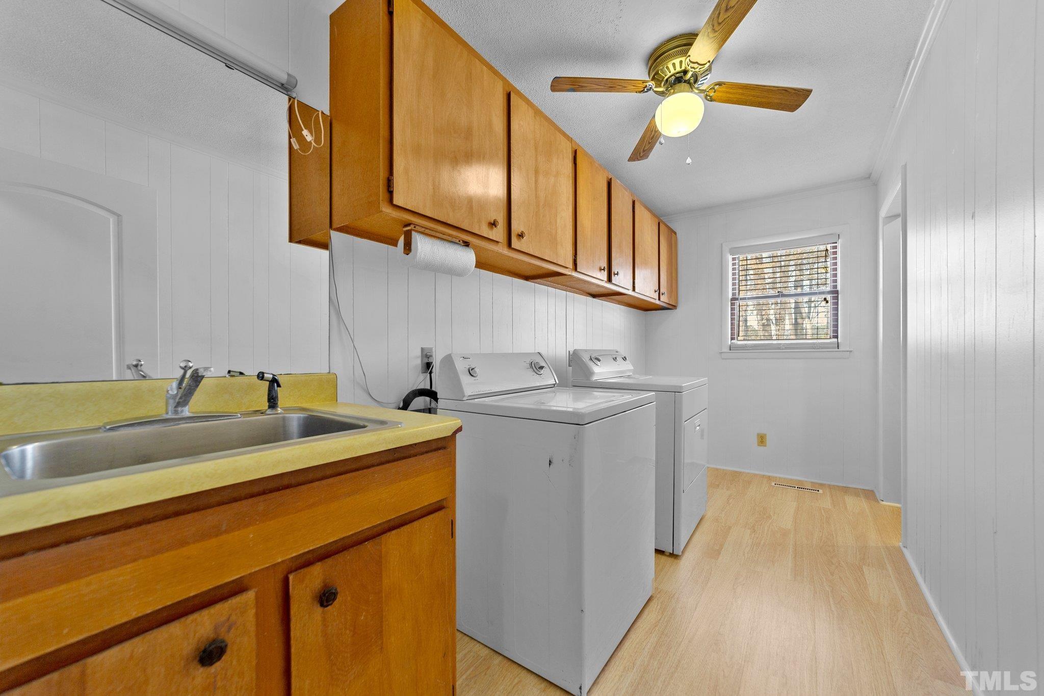 1275 Spring Valley Lake Road Henderson, NC 27537 - Photo 17 of 30 a utility room with dryer and washer