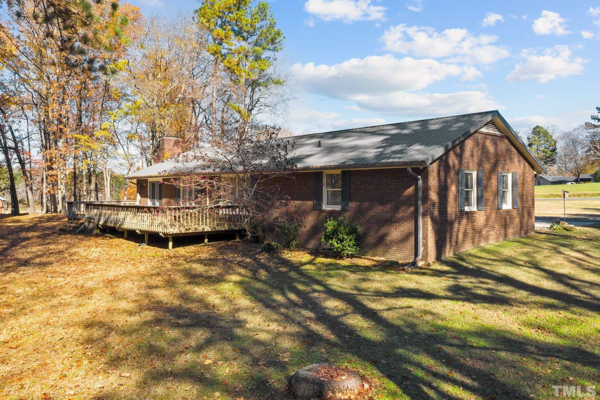 1275 Spring Valley Lake Road Henderson, NC 27537 - Photo 28 of 30 a view of a house with a yard