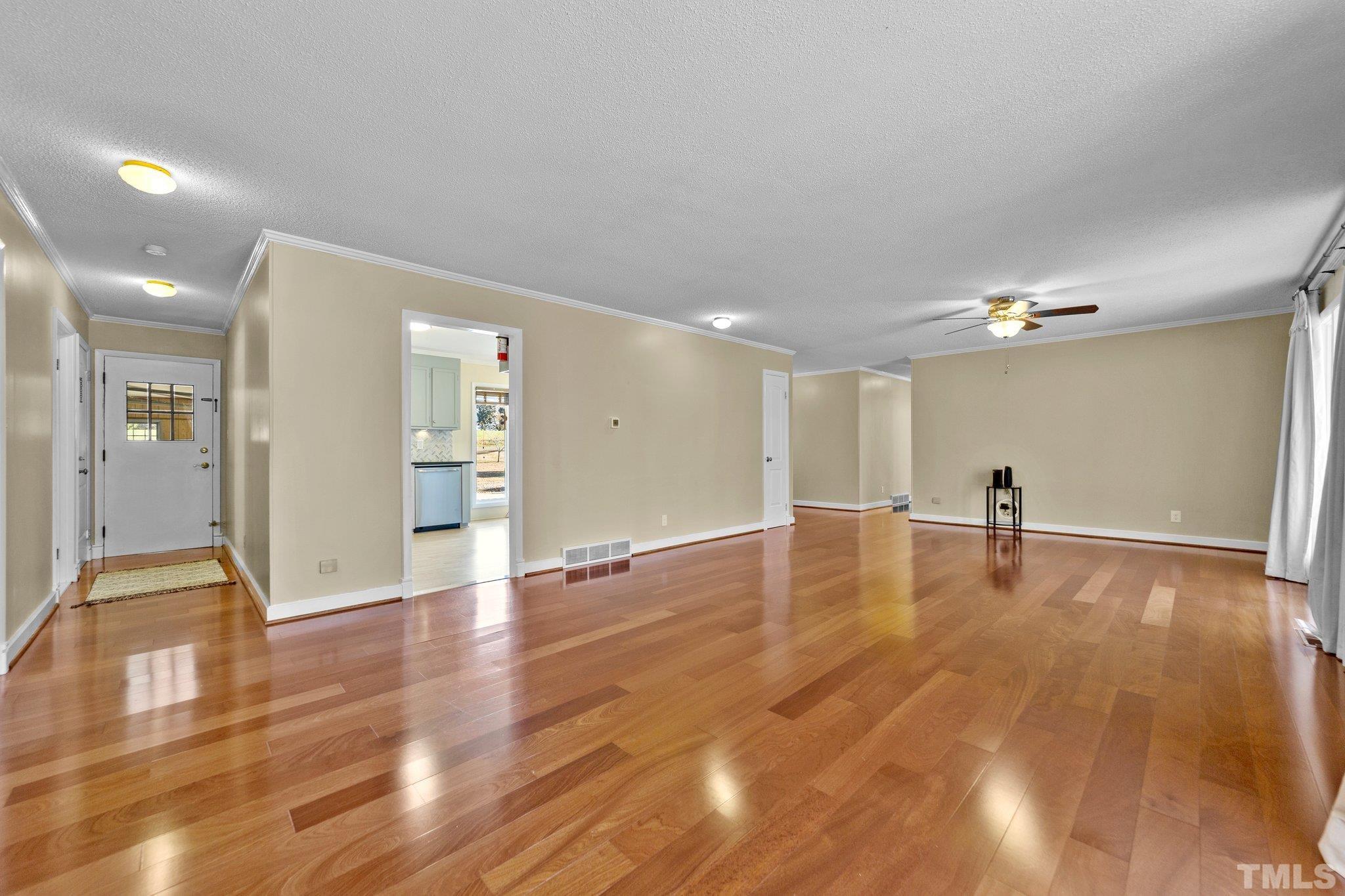1275 Spring Valley Lake Road Henderson, NC 27537 - Photo 6 of 30 a view of empty room with wooden floor