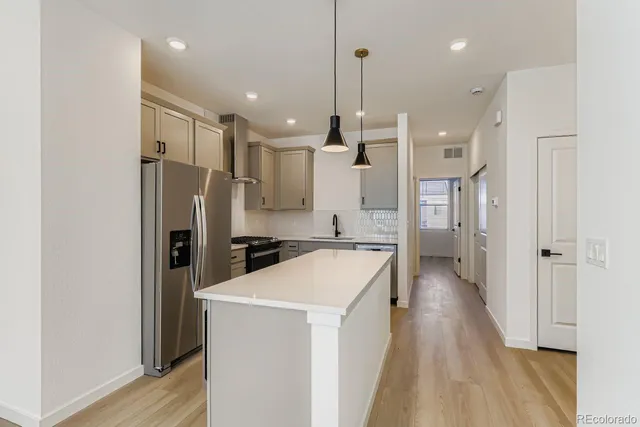 a bathroom with a sink a toilet and a bathtub