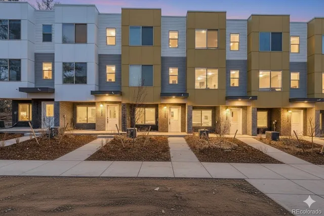 a view of wooden floor and windows in a room