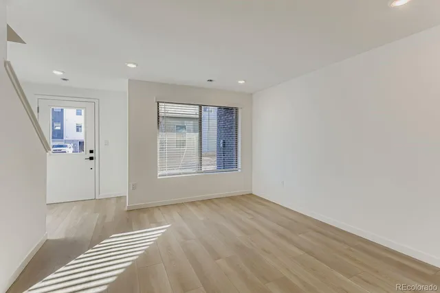 a kitchen with a sink a stove and a refrigerator