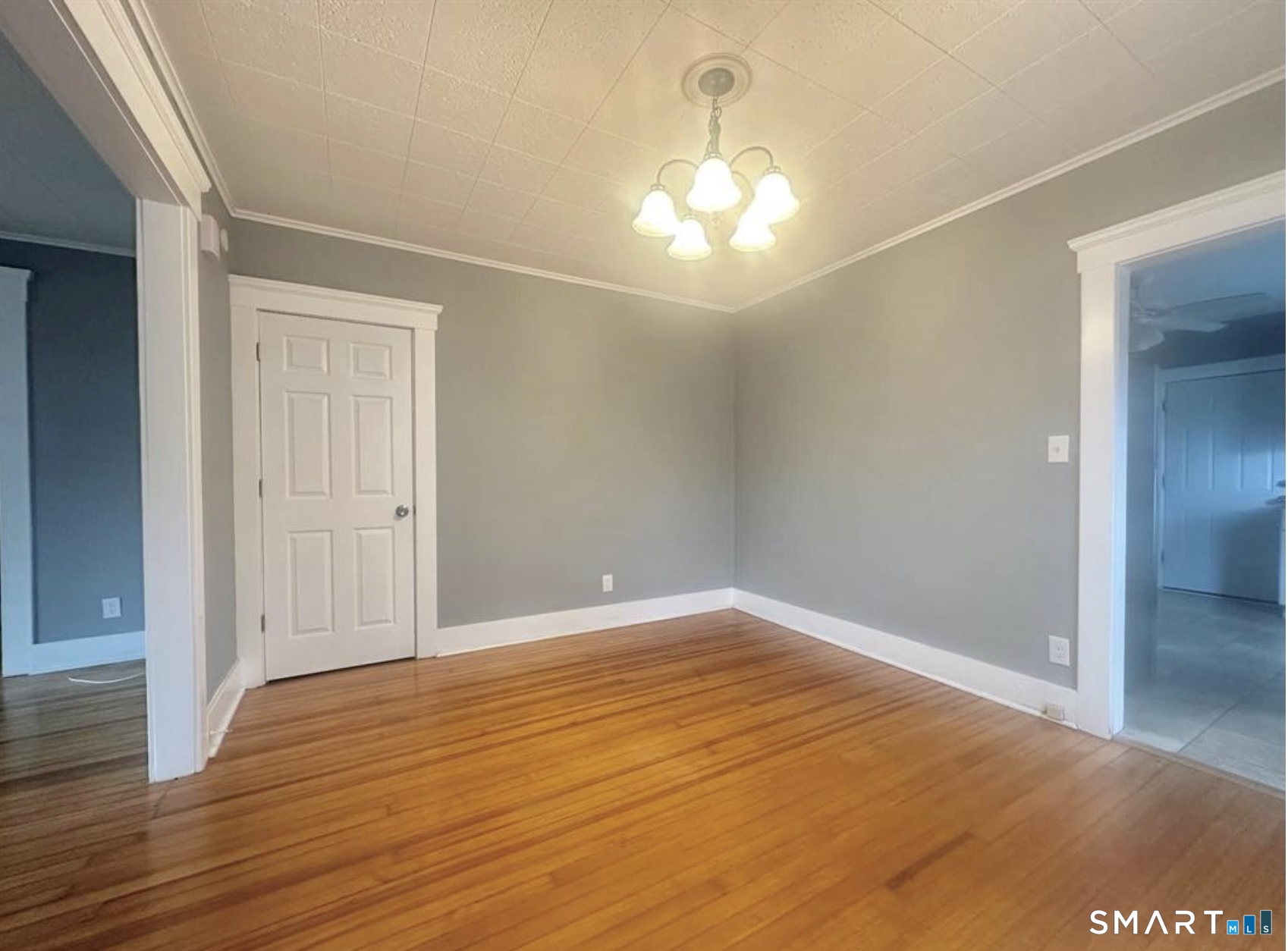 49 Dutton Street Wallingford, CT 06492 - Photo 7 of 10 a view of an empty room with wooden floor