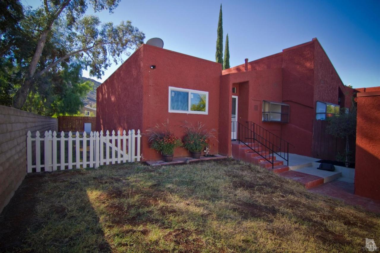 6408 Katherine Road, Unit A Simi Valley, CA 93063 - Photo 1 of 11 a front view of a house with a yard