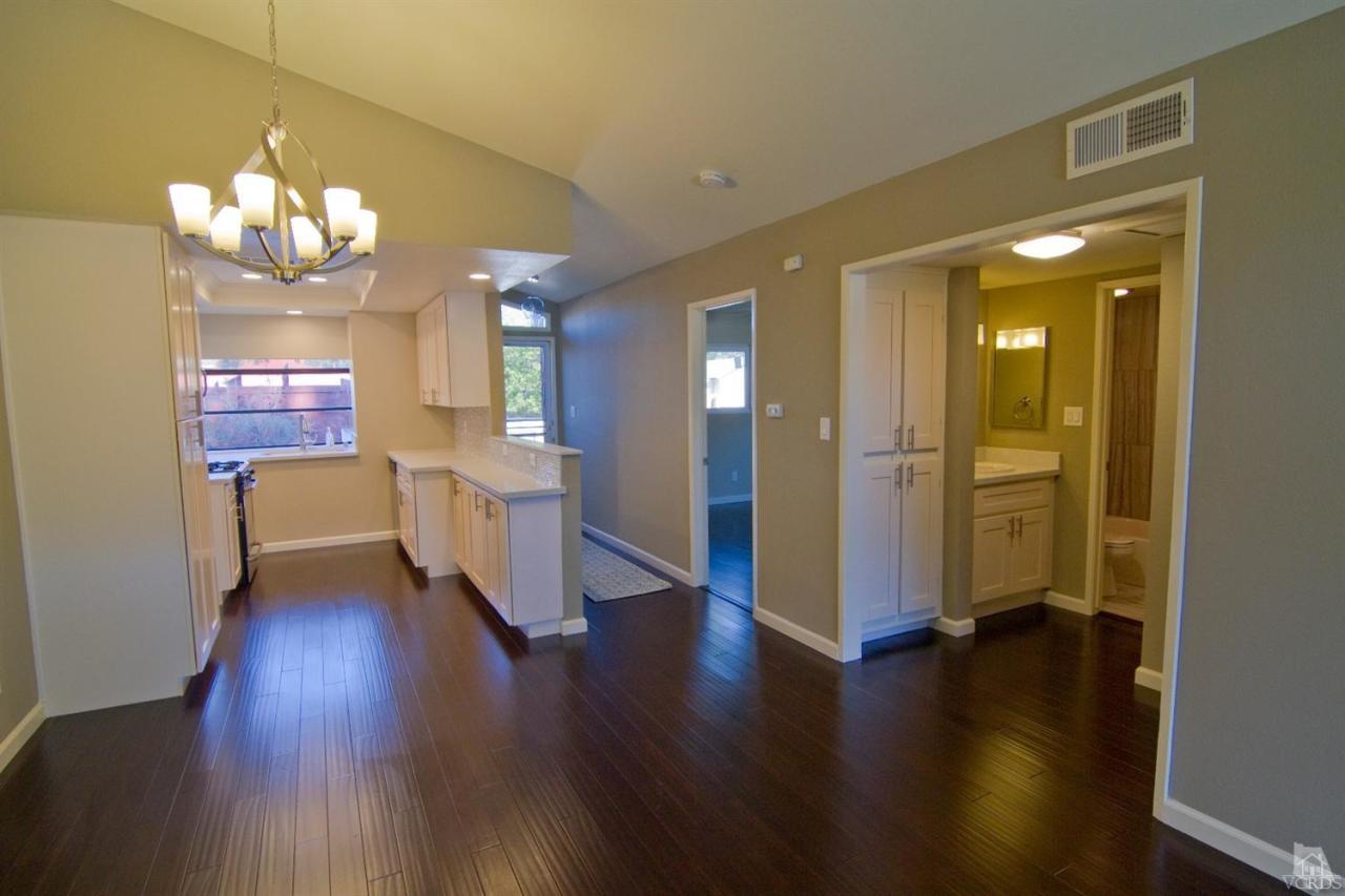 6408 Katherine Road, Unit A Simi Valley, CA 93063 - Photo 2 of 11 a view of a room with wooden floor and kitchen view