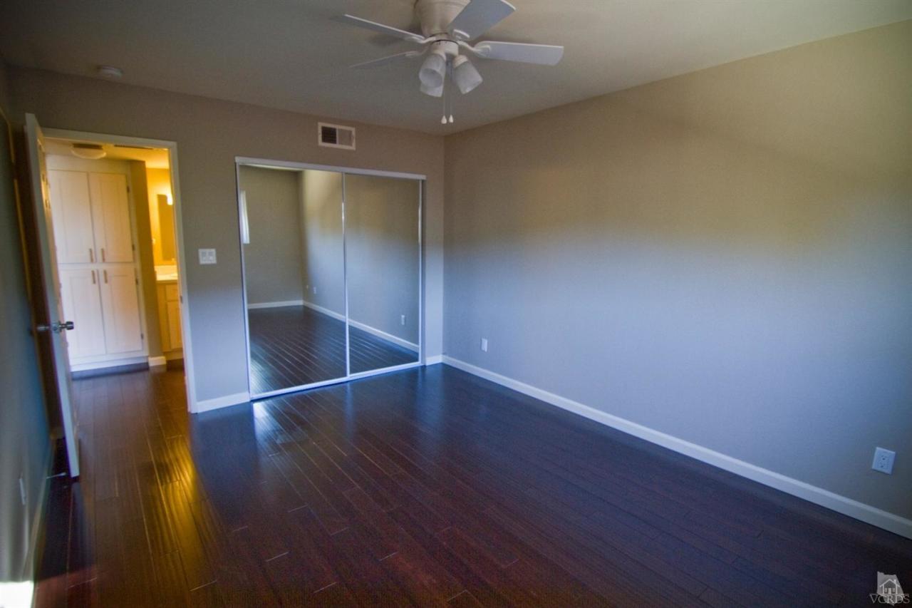 6408 Katherine Road, Unit A Simi Valley, CA 93063 - Photo 9 of 11 an empty room with wooden floor and door