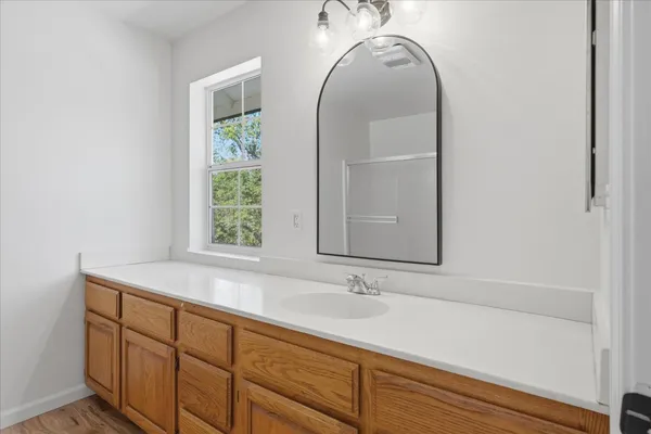 a bathroom with a sink and a mirror