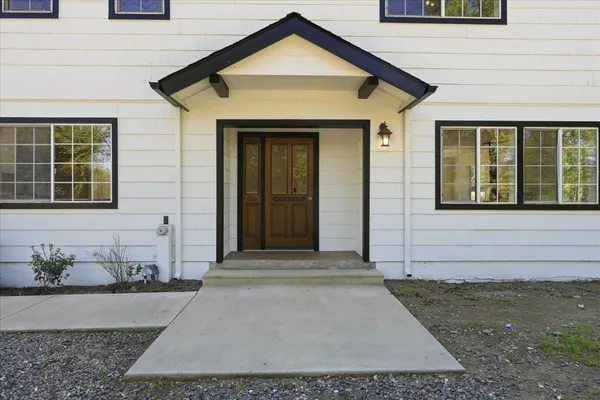 a front view of a house with a yard