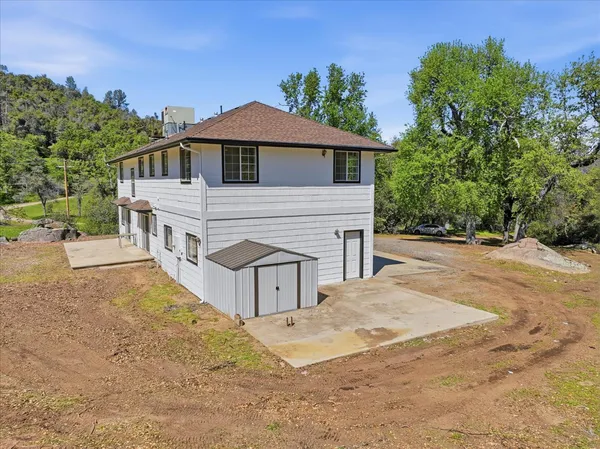 view of a house with a tree