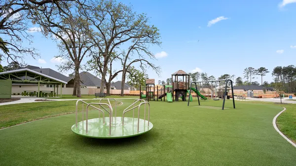 a childrens park with lots of swings and slides