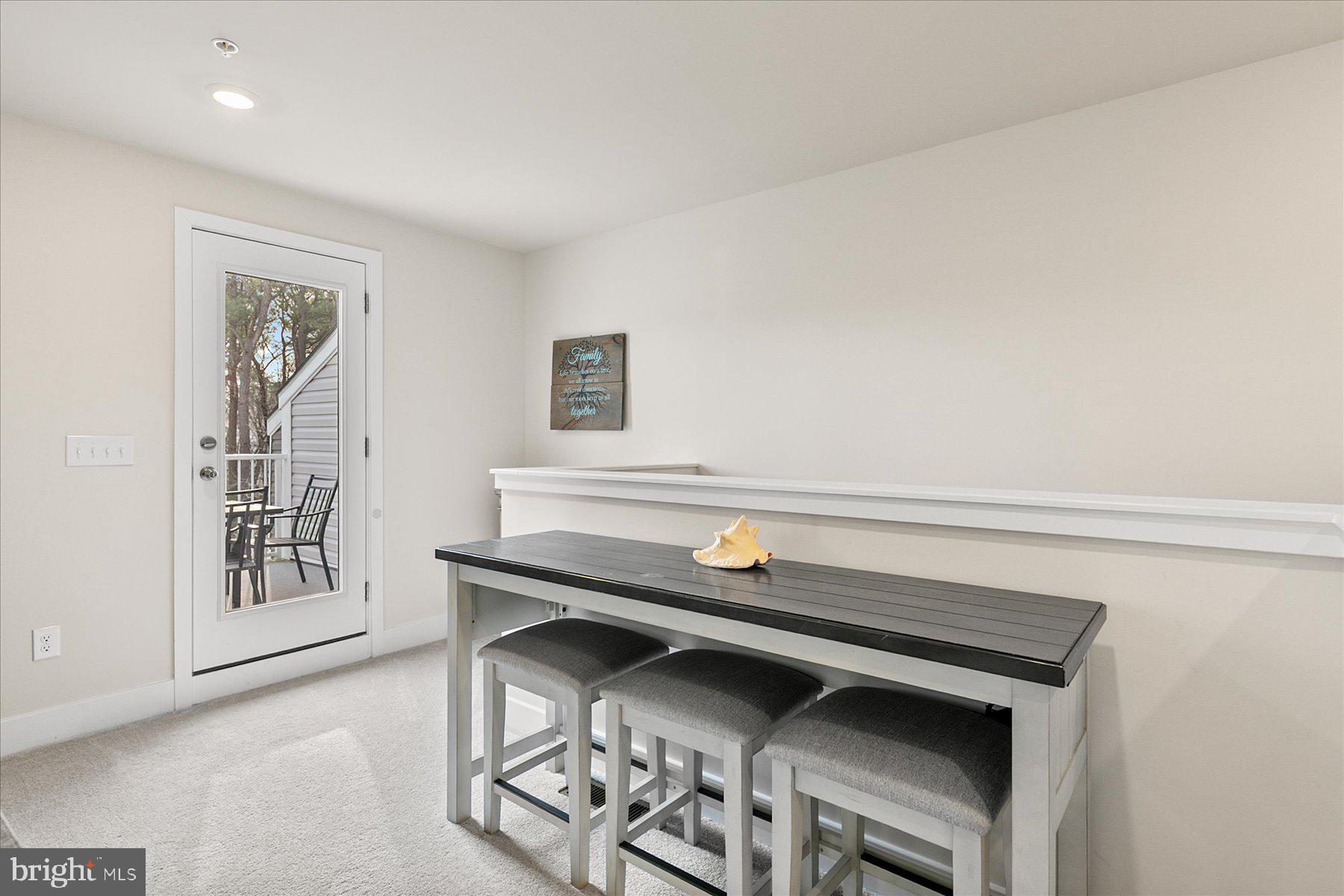 9503 Seascape Lane, Unit 4 Berlin, MD 21811 - Photo 11 of 52 a room with a table and a window