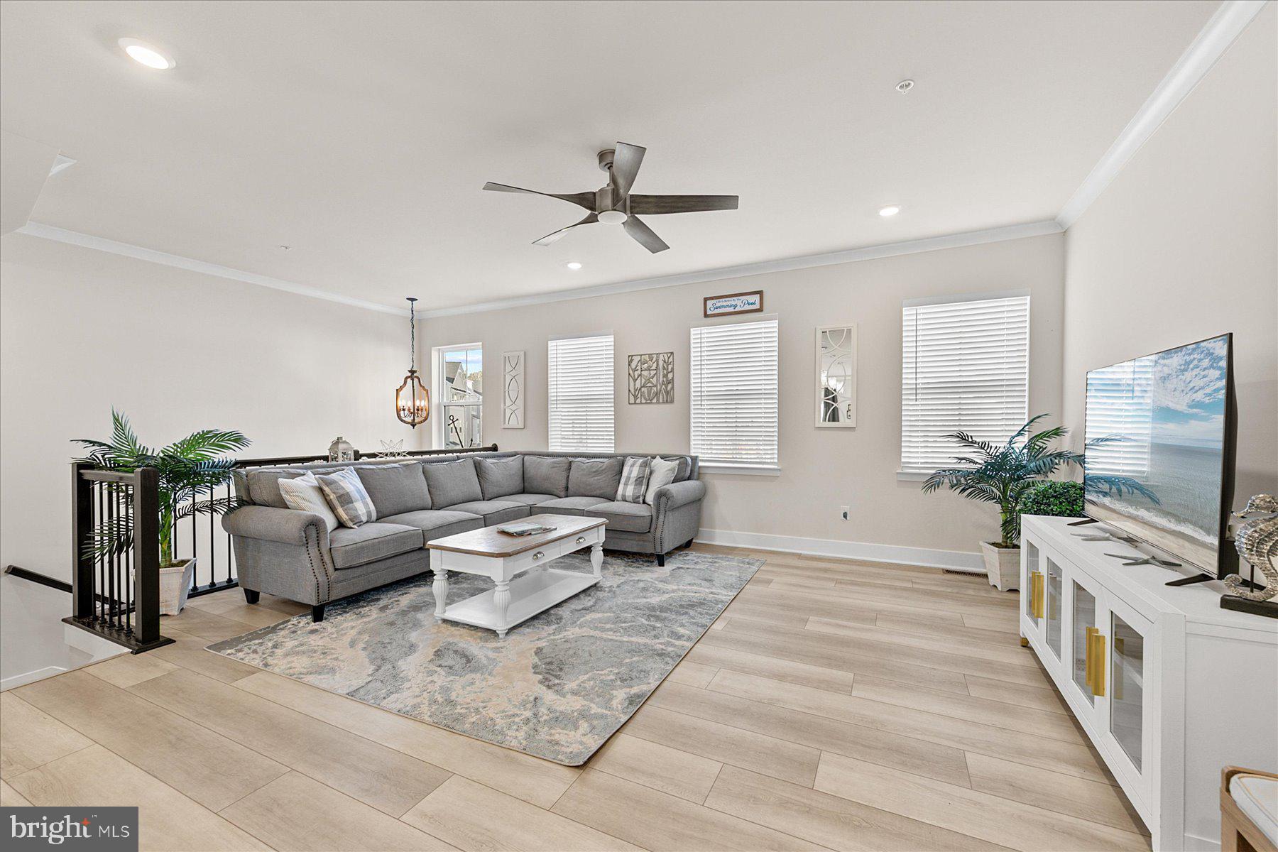 9503 Seascape Lane, Unit 4 Berlin, MD 21811 - Photo 3 of 52 a living room with furniture and a flat screen tv