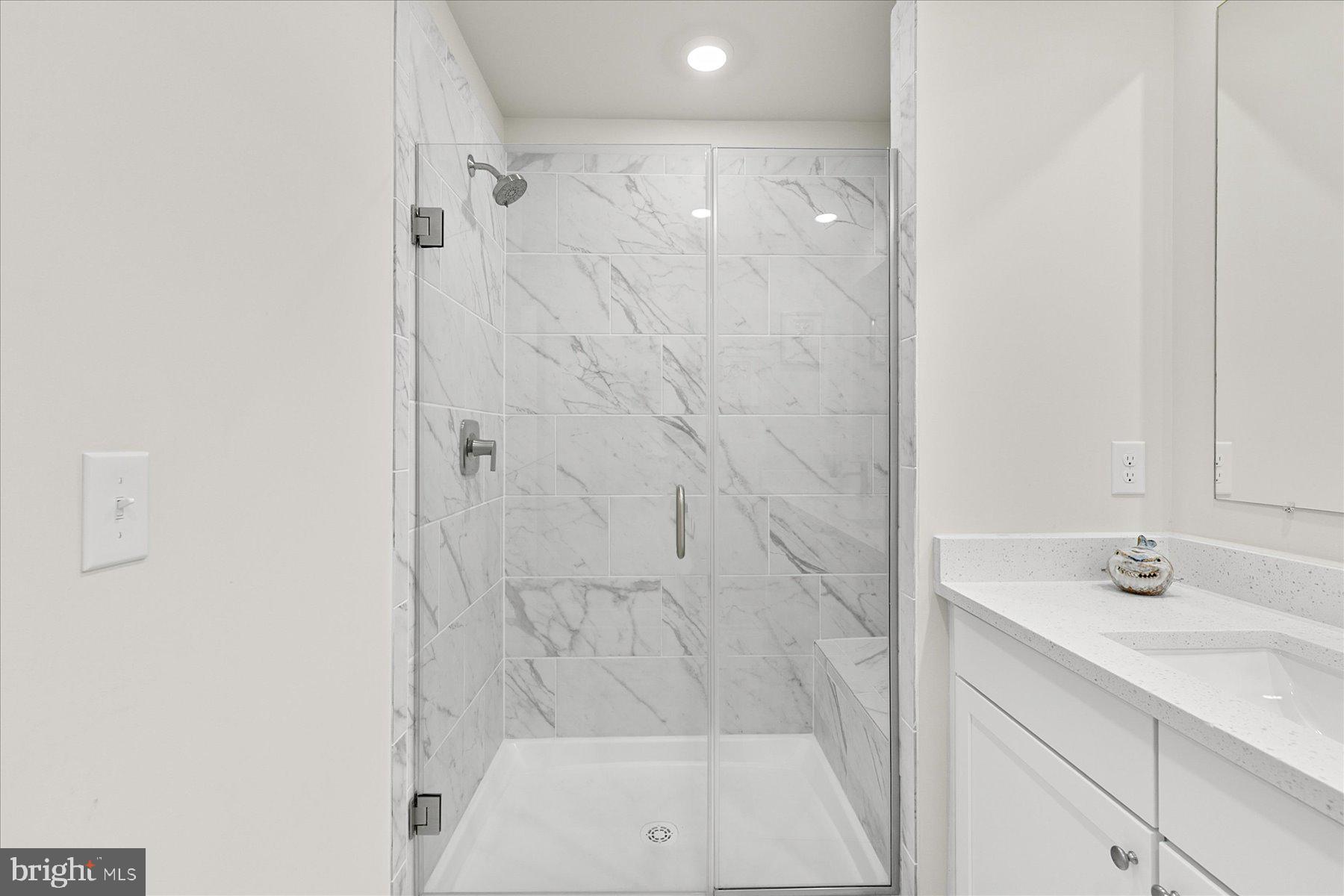 9503 Seascape Lane, Unit 4 Berlin, MD 21811 - Photo 32 of 52 a bathroom with a shower and a sink