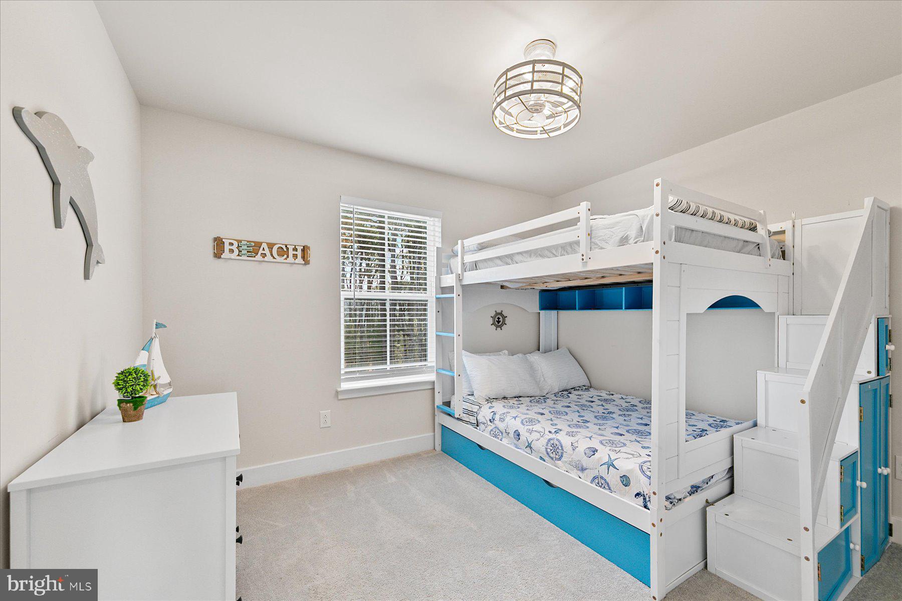 9503 Seascape Lane, Unit 4 Berlin, MD 21811 - Photo 36 of 52 a bedroom with a bed and a window