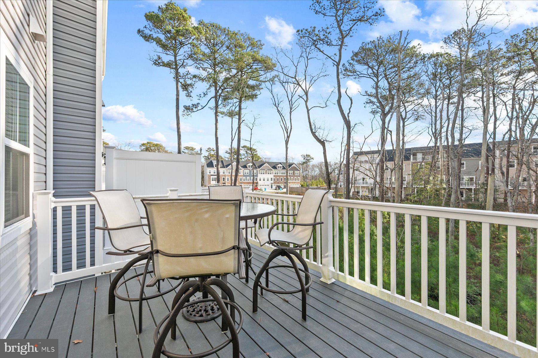 9503 Seascape Lane, Unit 4 Berlin, MD 21811 - Photo 44 of 52 a view of a chairs and table on the deck