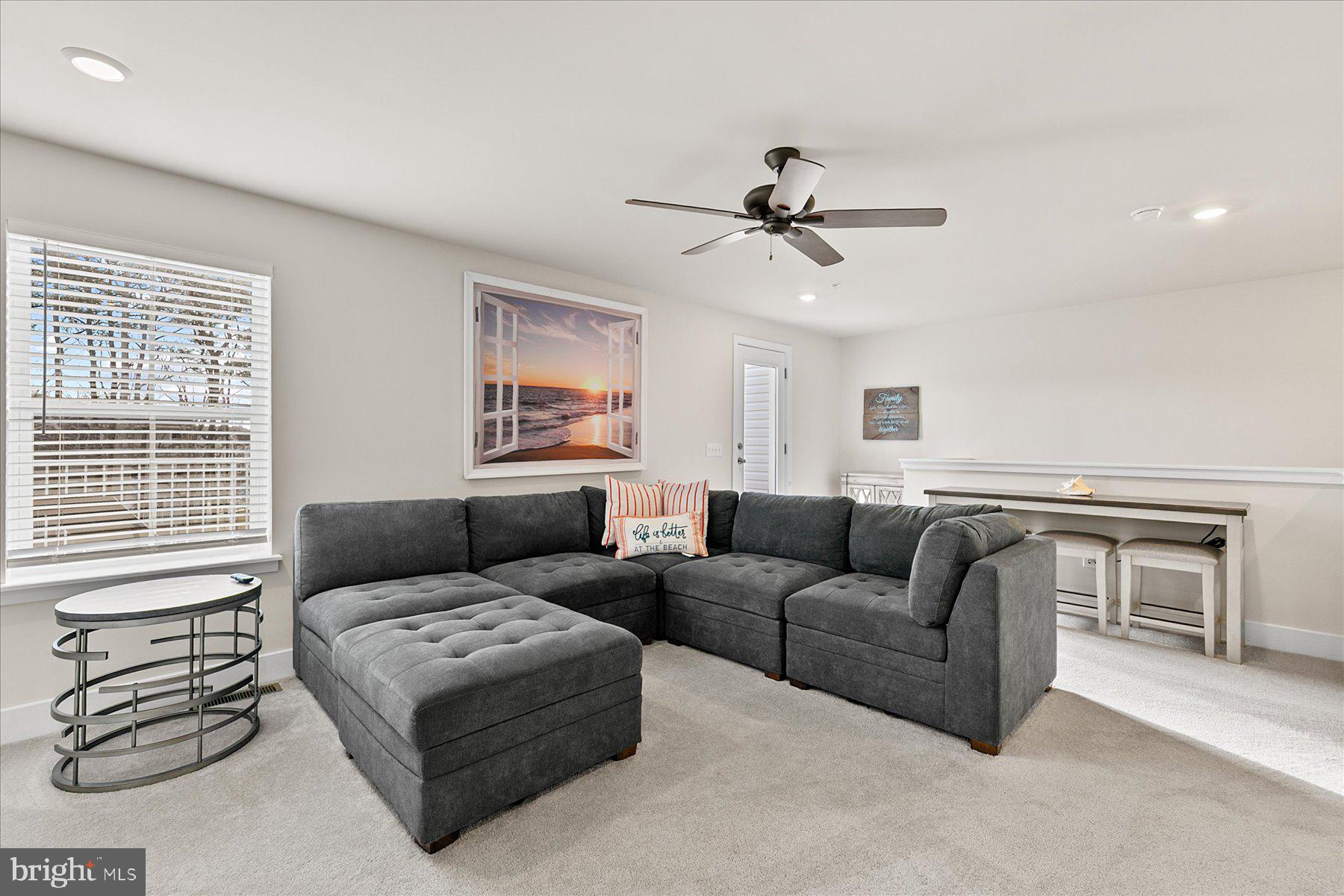 9503 Seascape Lane, Unit 4 Berlin, MD 21811 - Photo 9 of 52 a living room with furniture and a window