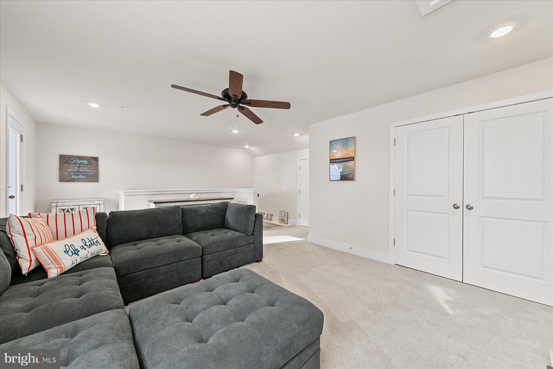9503 Seascape Lane, Unit 4 Berlin, MD 21811 - Photo 10 of 52 a living room with furniture and a ceiling fan