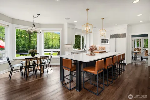 a view of a dining room with furniture window and wooden floor
