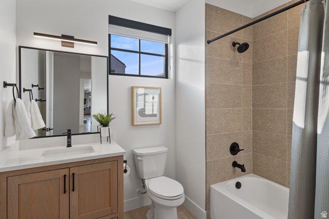 5367 Cyan Lane St. George, UT 84790 - Photo 3 of 49 Contemporary bathroom featuring a light wood-finish vanity with white countertop, black-framed mirror, and matte black fixtures