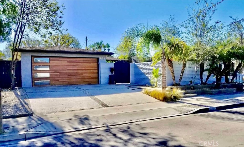 273 Cecil Place Costa Mesa, CA 92627 - Photo 18 of 18 a house with palm tree in front of it
