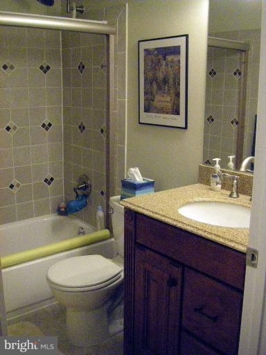 1844 Post Oak Trail Reston, VA 20191 - Photo 14 of 27 a bathroom with a sink a toilet and bathtub