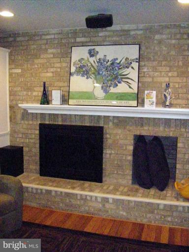 1844 Post Oak Trail Reston, VA 20191 - Photo 17 of 27 a fireplace with a cabinet