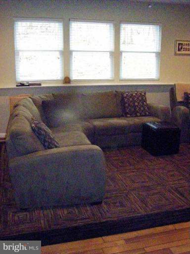 1844 Post Oak Trail Reston, VA 20191 - Photo 20 of 27 a living room with furniture and a large window