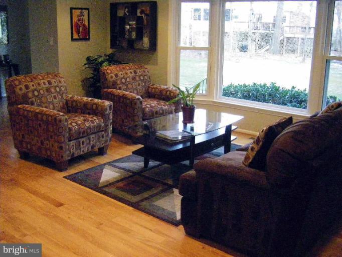 1844 Post Oak Trail Reston, VA 20191 - Photo 23 of 27 a living room with furniture and a large window
