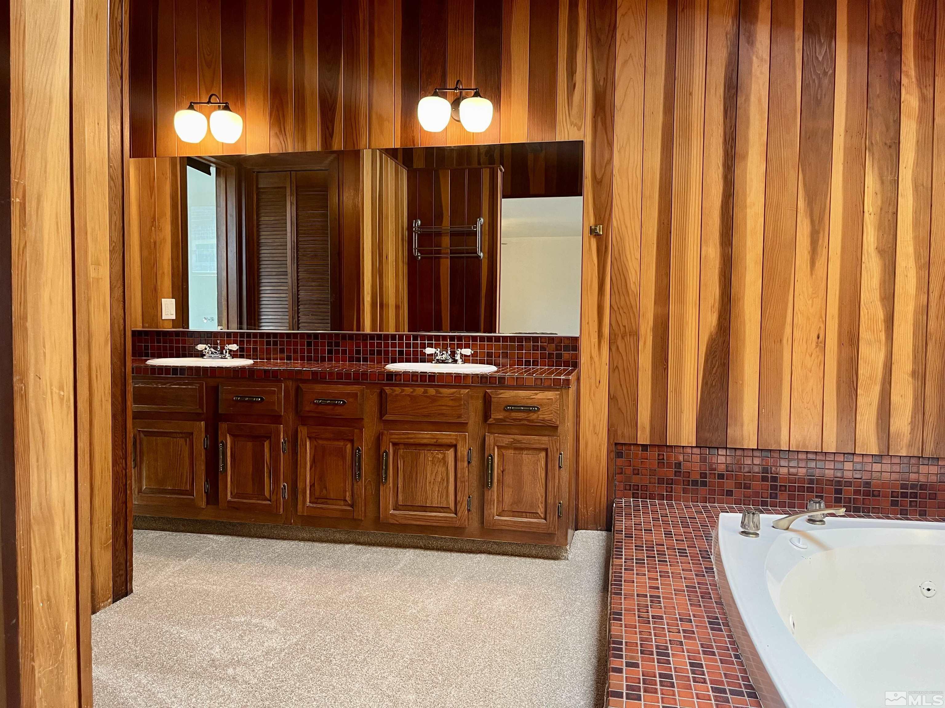 860 East Taylor Street Reno, NV 89502 - Photo 11 of 24 a bathroom with a sink and a mirror