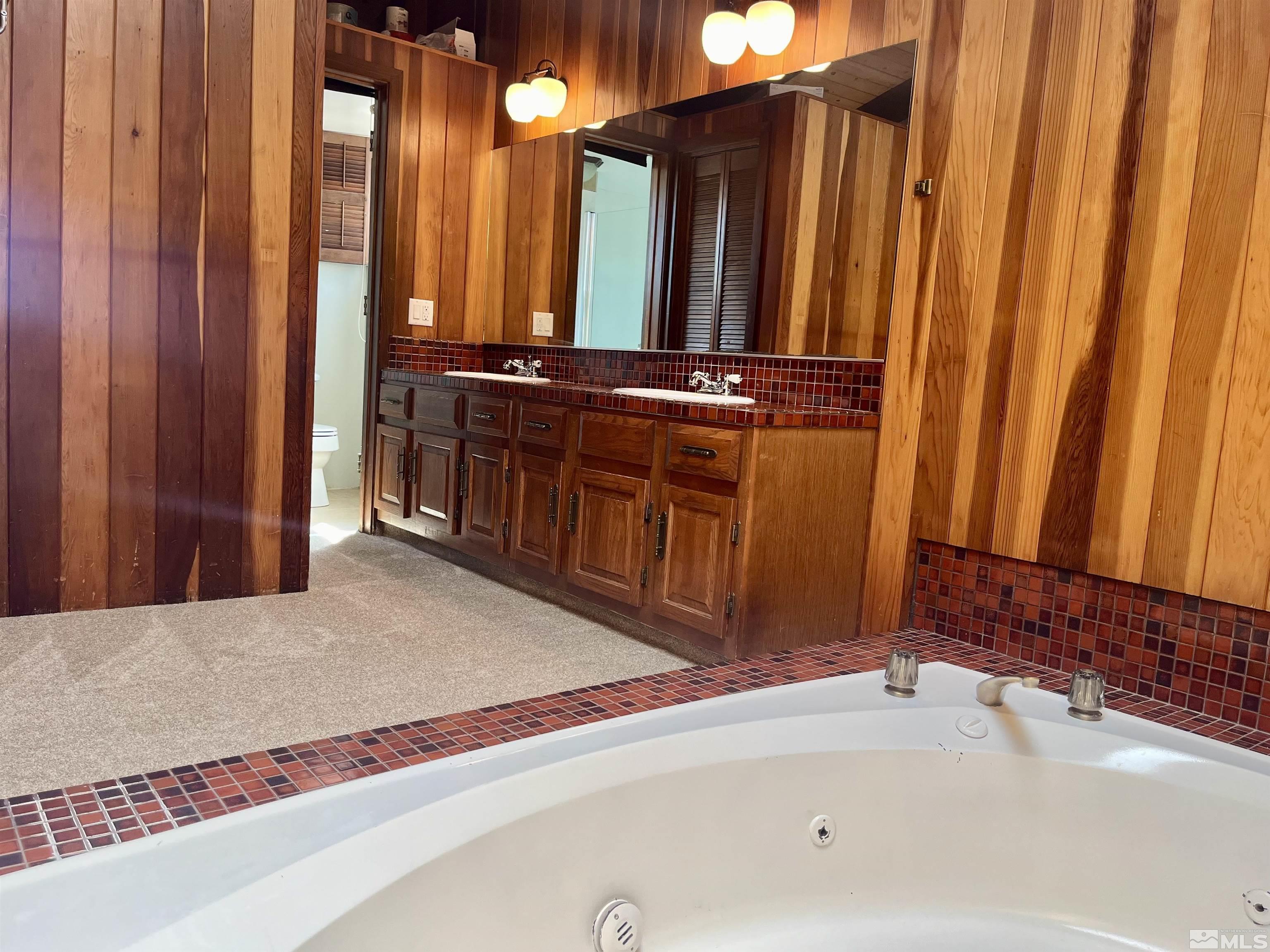 860 East Taylor Street Reno, NV 89502 - Photo 12 of 24 a bathroom with a bathtub and shower