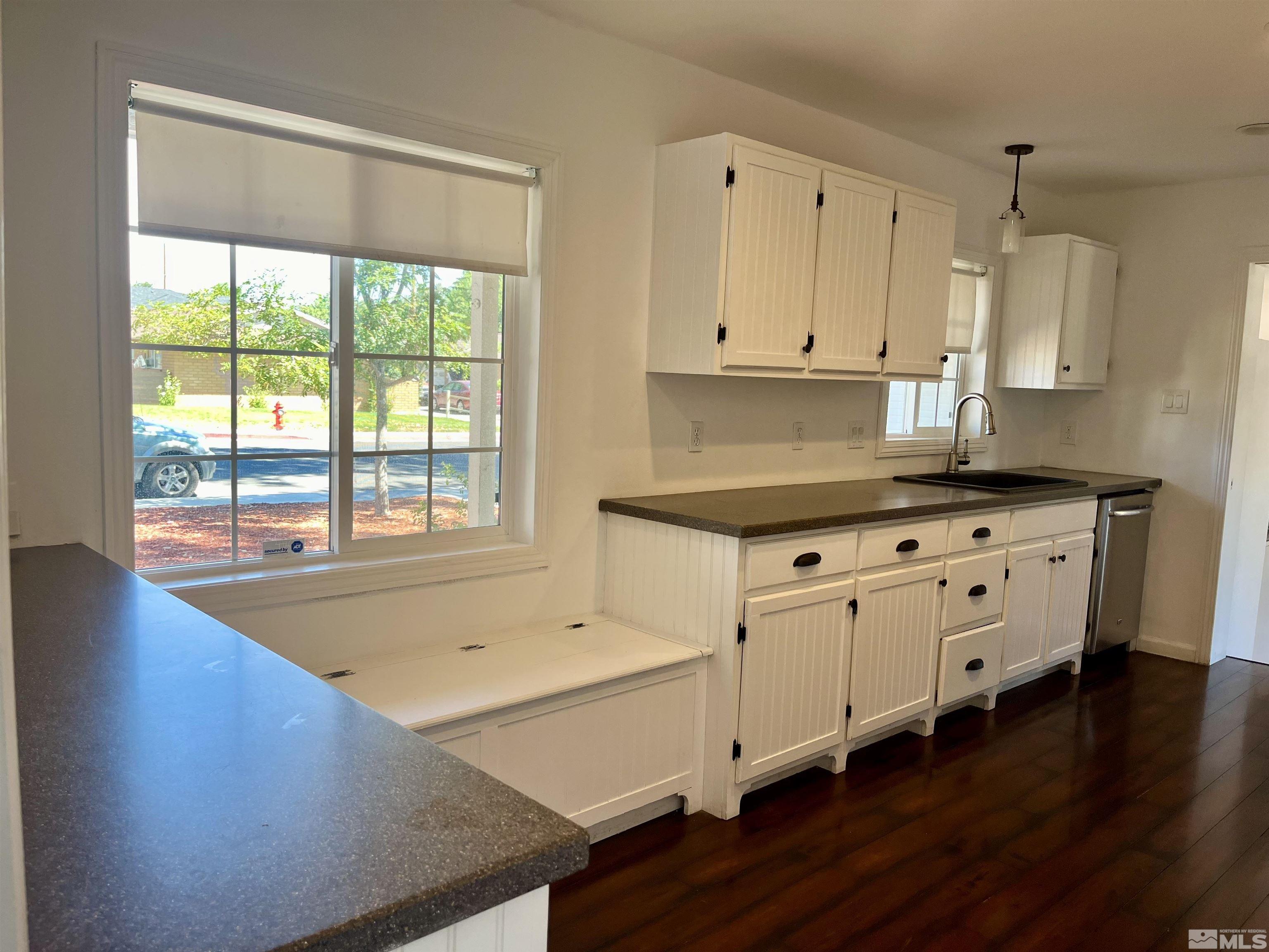 860 East Taylor Street Reno, NV 89502 - Photo 2 of 24 a kitchen with appliances cabinets and a wooden floor