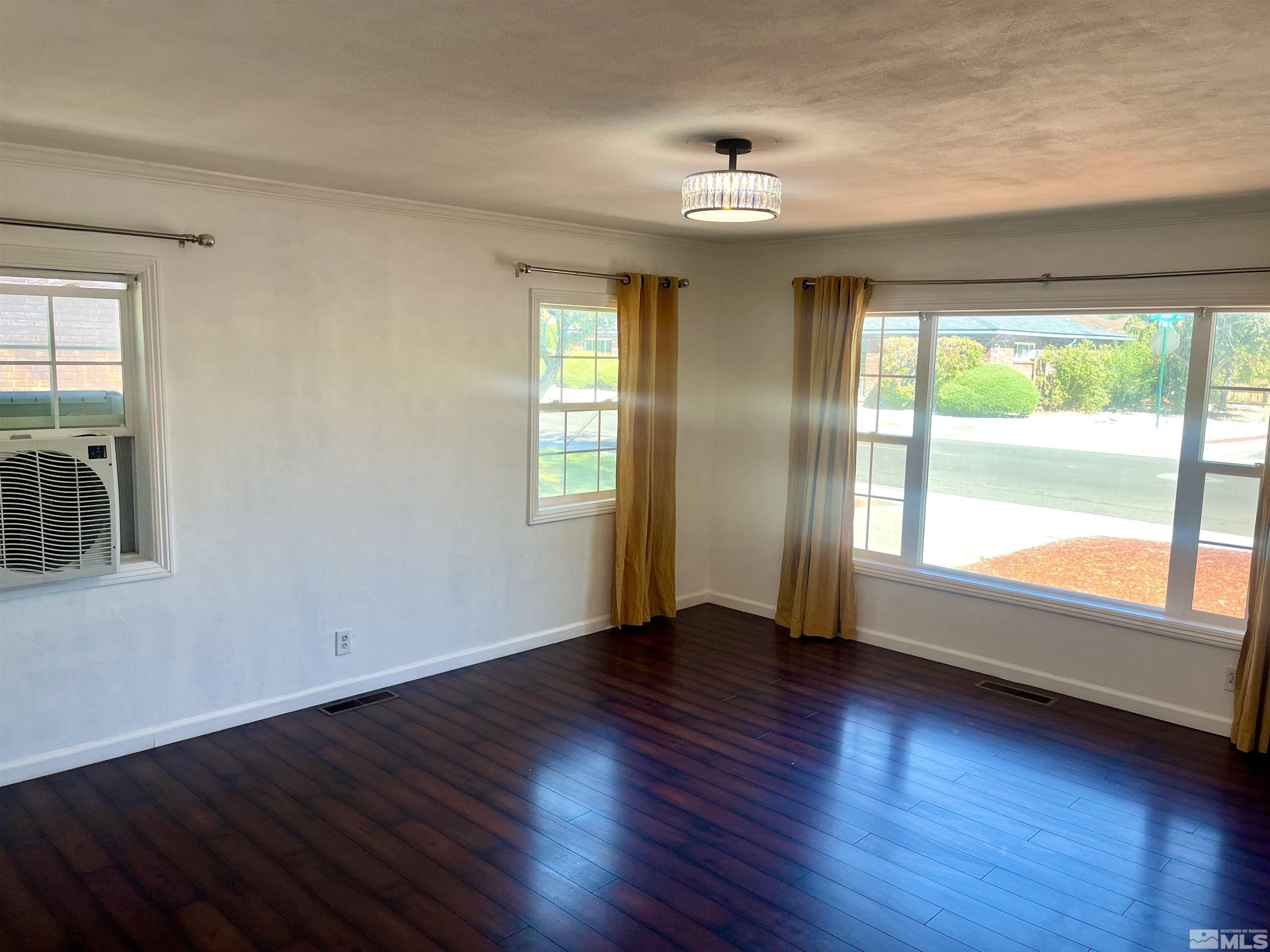 860 East Taylor Street Reno, NV 89502 - Photo 23 of 24 a view of an empty room with wooden floor and a window