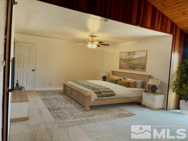 860 East Taylor Street Reno, NV 89502 - Photo 8 of 24 a bedroom with a bed and a chandelier