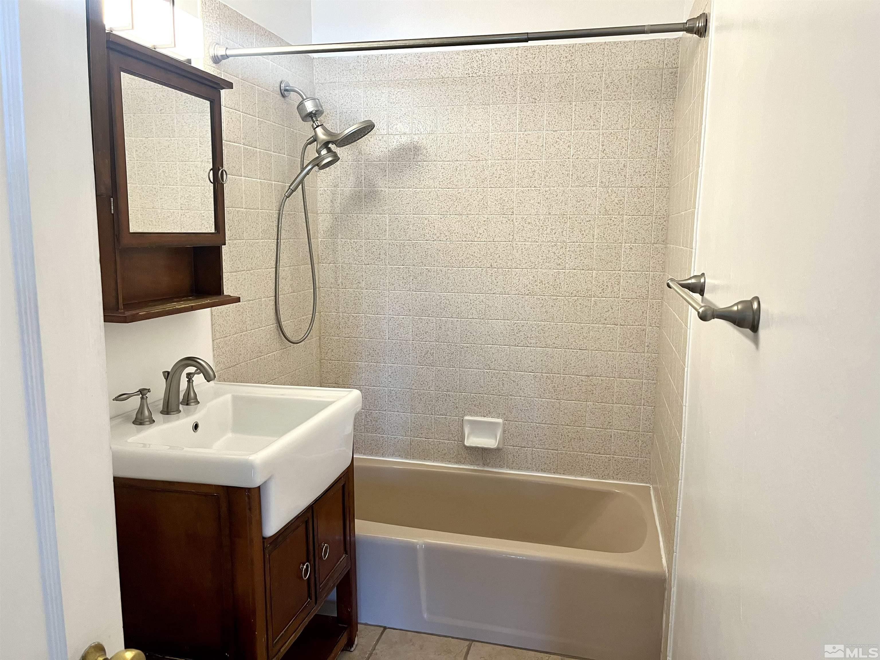 860 East Taylor Street Reno, NV 89502 - Photo 10 of 24 a bathroom with a sink mirror toilet and bathtub