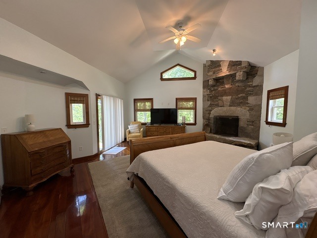 40 Looking Glass Hill Road Litchfield, CT 06750 - Photo 19 of 33 a bedroom with a bed lamps and fireplace