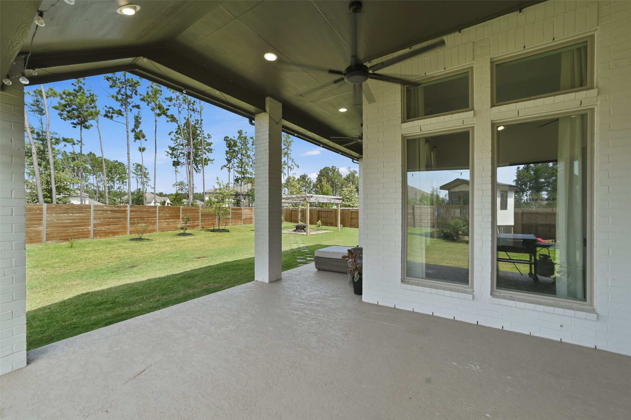 17801 Parnassum Path Conroe, TX 77302 - Photo 30 of 41 Plenty of shade and room on this upgraded extended back patio