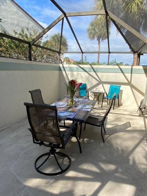 a view of outdoor space with table and chairs