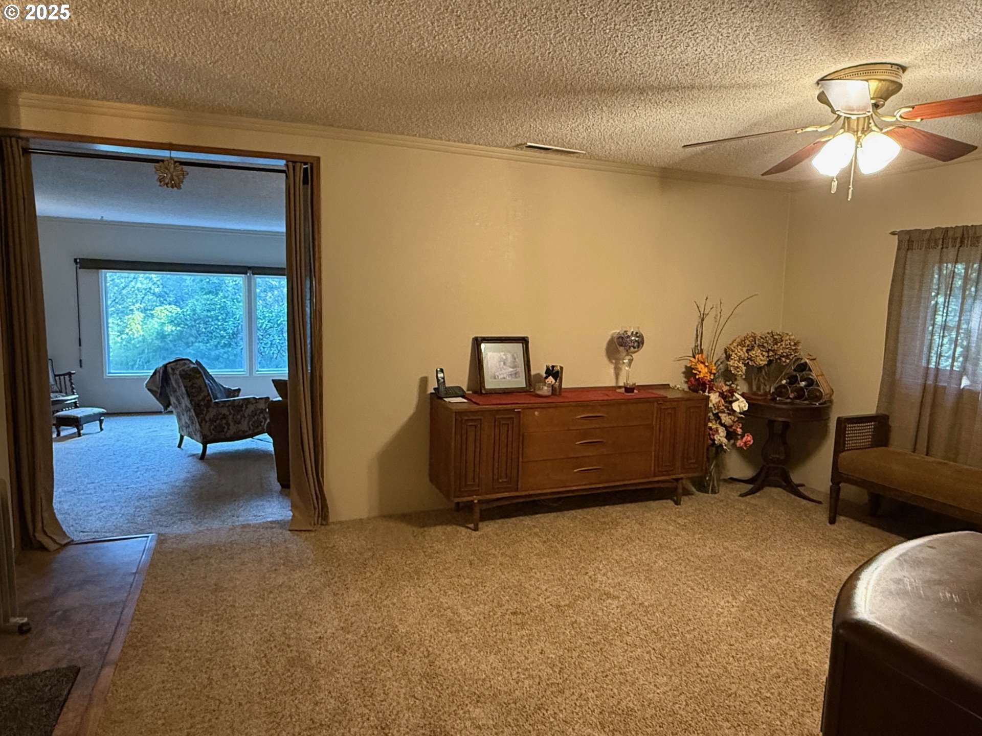 87511 Tiernan Road Mapleton, OR 97453 - Photo 11 of 23 a bedroom with furniture and a chandelier