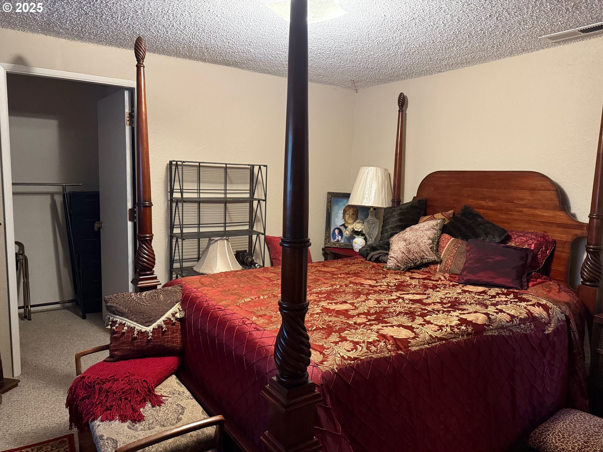 87511 Tiernan Road Mapleton, OR 97453 - Photo 15 of 23 a bedroom with a large bed and a window