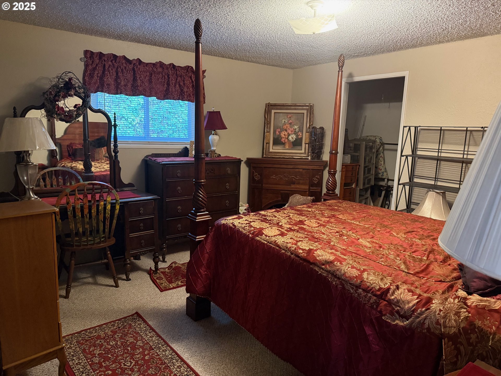 87511 Tiernan Road Mapleton, OR 97453 - Photo 16 of 23 a bed sitting in a bedroom next to a window