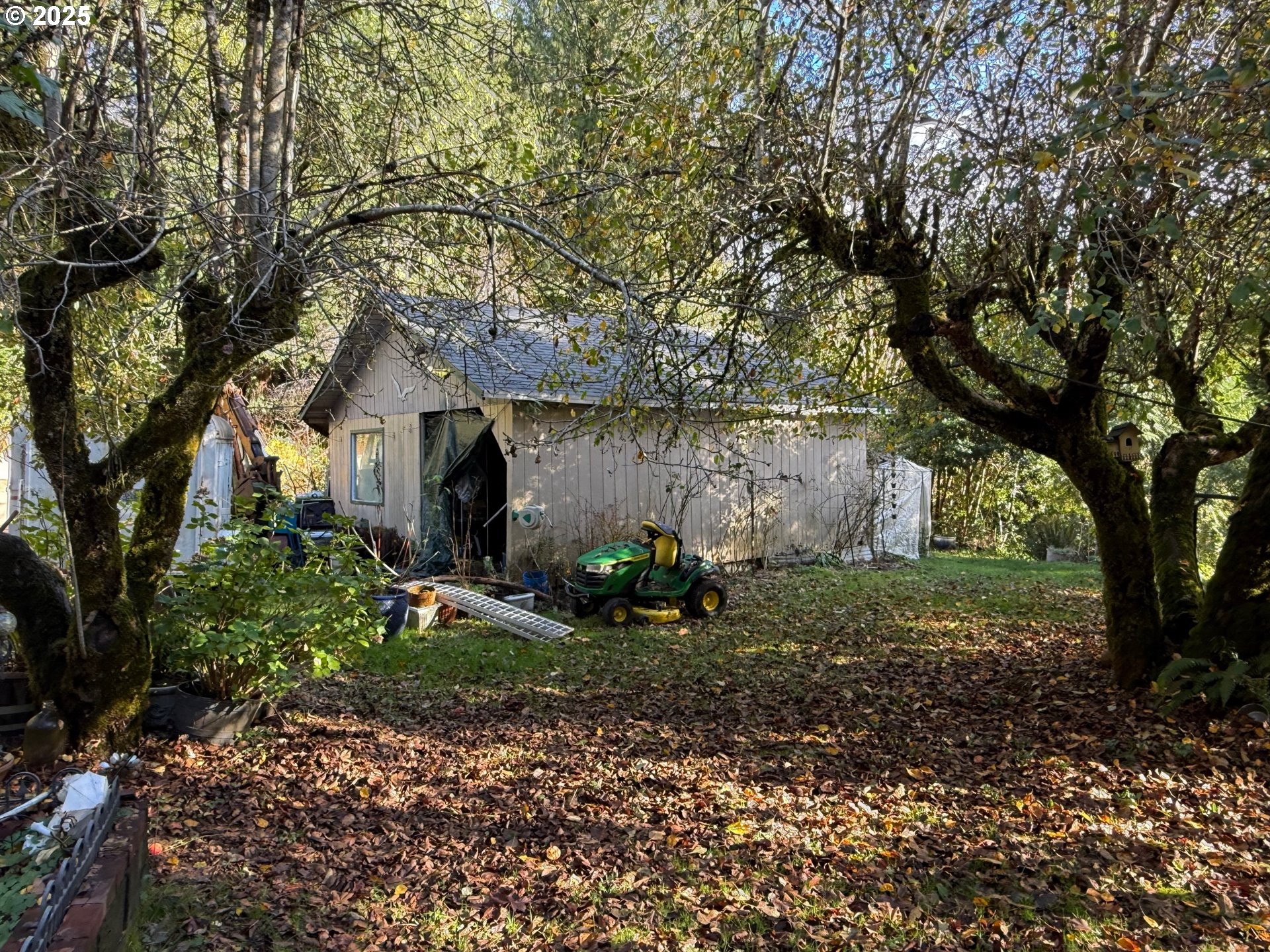 87511 Tiernan Road Mapleton, OR 97453 - Photo 22 of 23 a view of a house with a yard